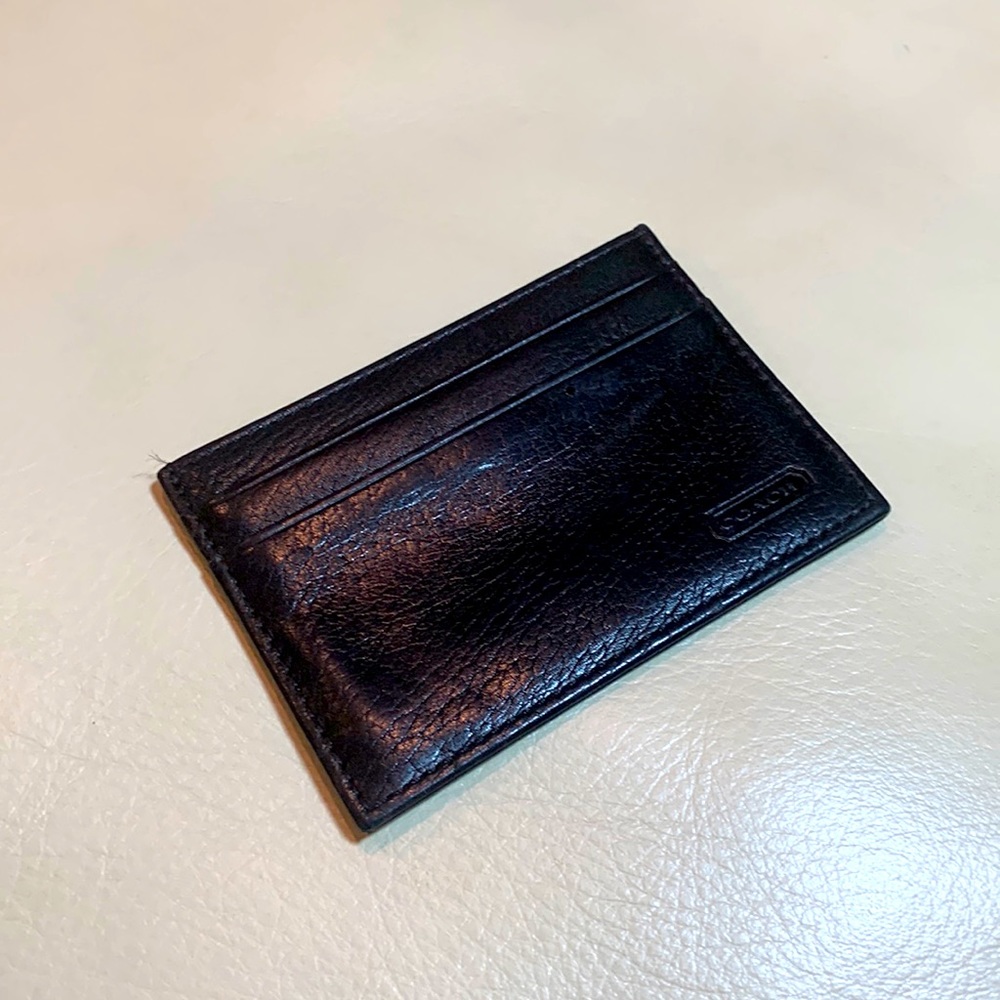 Coach black leather slim card holder wallet.